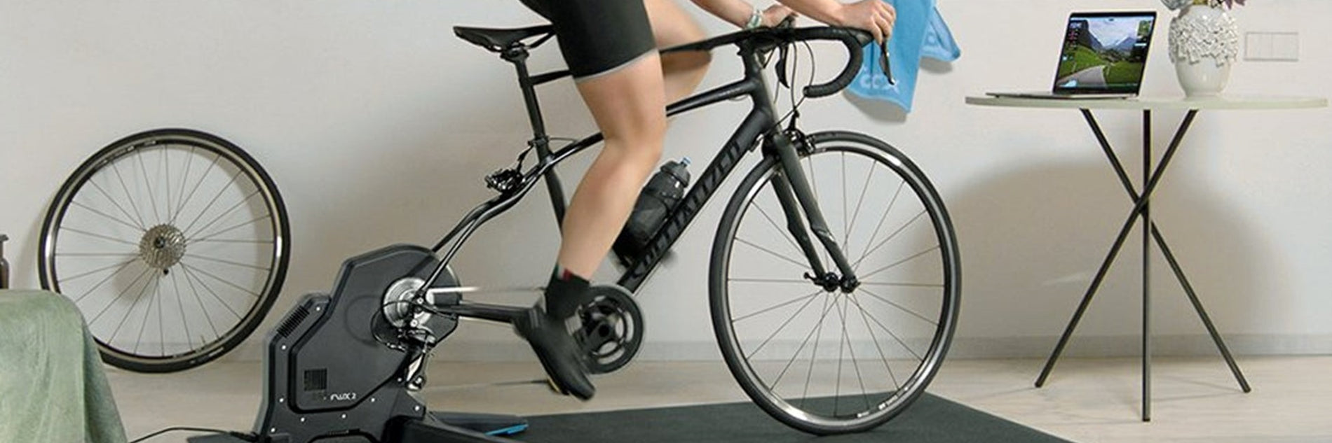 Woman Riding A Specialized Road Bike On A Tacx Indoor Bike Trainer in Edmonton Canada