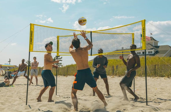 4 Men Play Crossnet on the beach. Shop Crossnet Four Way Four Square Volleyball Game Edmonton Canada